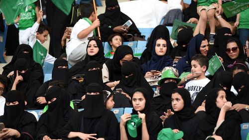 Hundreds of women thronged a sports stadium for the first time to mark Saudi Arabia's national day on Saturday. (AFP)