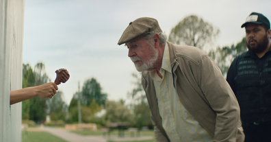 Old man about to take a bite of lamb cutlet in Australian Lamb summer ad 2021