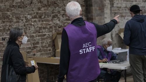 People cast their ballots during early voting for the seat of Wentworth at Oxford Street Mall on May 20, 2022 in Sydney, Australia. Independent Allegra Spender is standing for the seat of Wentworth against Liberal incumbent Dave Sharma. The Australian federal election will be held on Saturday 21 May 2022. (Photo by Brook Mitchell/Getty Images)