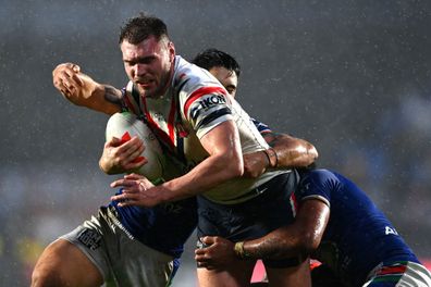 Angus Crichton of the Roosters charges forward at Mt Smart Stadium.