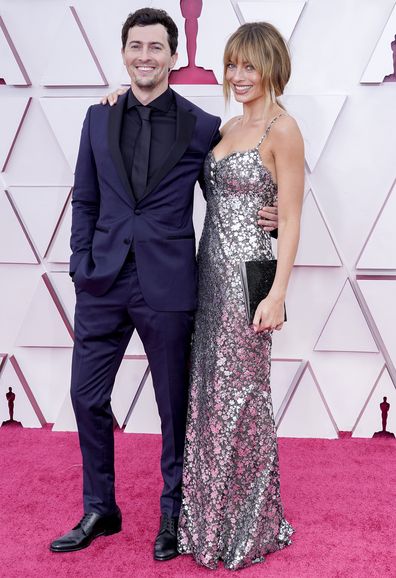 Josey McNamara and Margot Robbie arrive at the Oscars on Sunday, April 25, 2021, at Union Station in Los Angeles. 