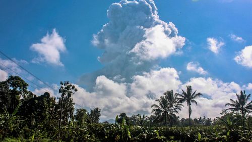 A plume of hot ash can be seen extending six kilometres into the air after an eruption at Mount Merapi.