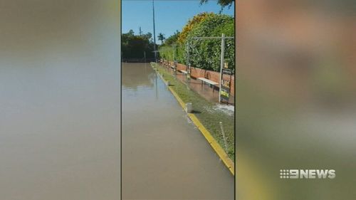 The burst water main caused chaos in Greenslopes as it caused significant damage to furniture, bowling greens and the street. Picture: 9NEWS.