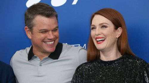 Actors Matt Damon, left, and Julianne Moore pose for photographers at the photo call for the film "Suburbicon". (AP)