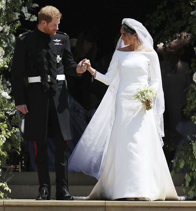 Meghan Markle and Britain's Prince Harry walk down the steps of St George's Chapel at Windsor Castle in Windsor, near London, England, following their wedding.