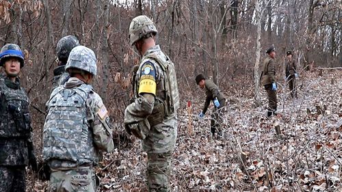  The two Koreas will connect the three-kilometer-long road the same day to support a joint project to excavate remains of soldiers who died in the three-year conflict.