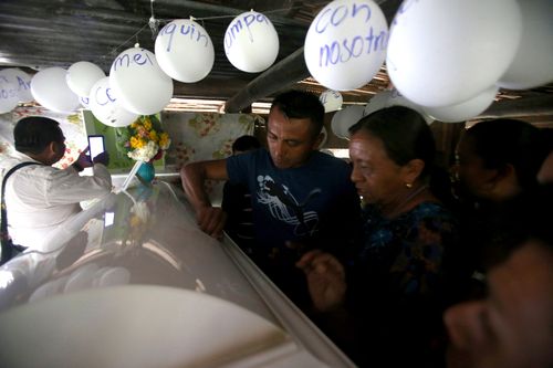 Neighbours and relatives attend the wake of Jakelin Caal, the immigrant girl who died earlier this month in the custody of the US Border Patrol, at her home in the village of San Antonio Secortez, in Guatemala.