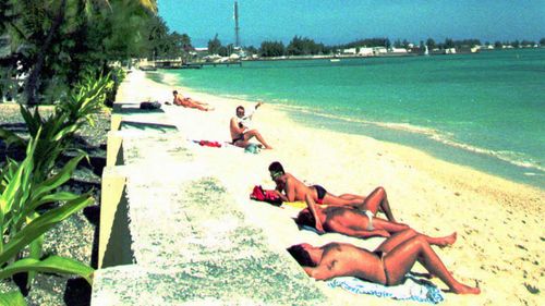 French soldiers soak up the sun at the Mururoa Atoll.