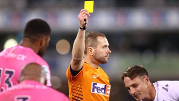 Referee Angus Gardner gives a yellow card to Darby Lancaster of the Rebels during the round 14 Super Rugby Pacific match between ACT Brumbies and Melbourne Rebels.