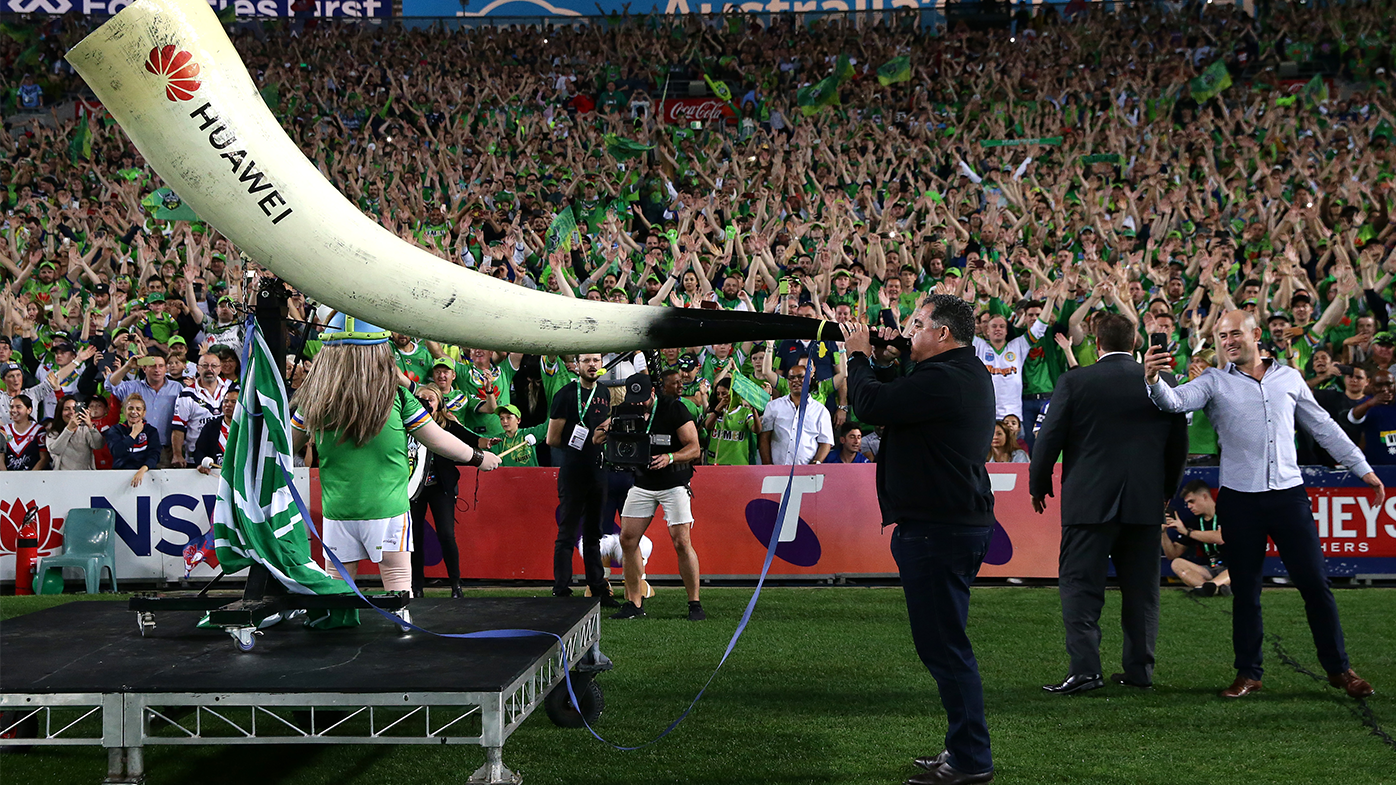 Former Raiders legend Mal Meninga blows the club&#x27;s Viking horn to lead the Viking Clap ahead of the 2019 NRL grand final match between the Canberra Raiders and the Sydney Roosters.