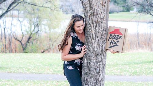 Well-seasoned love between woman and her pizza captured in viral engagement photos