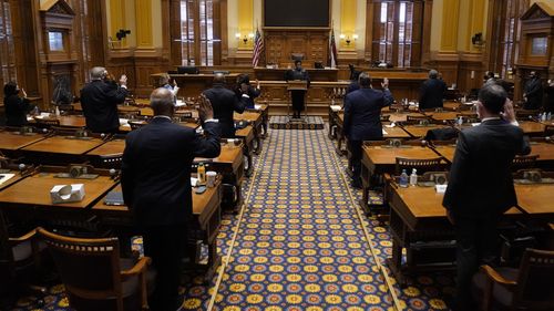 Members of Georgia's Electoral College are sworn in before casting their votes at the state Capitol, Dec. 14, 2020