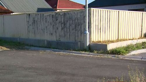 Mr Phillip's body was found against this fence, which is the backyard of a family home.