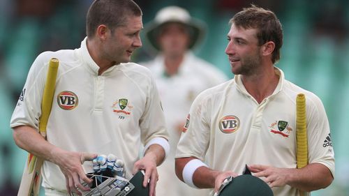 Former Australian captain Michael Clarke with Hughes. (AAP)