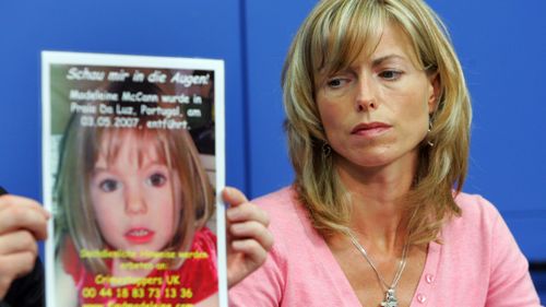 Kate McCann, the mother of the missing British girl Madeleine McCann, looks at a poster showing her missing daughter during a press conference on June 6, 2007 in Berlin.