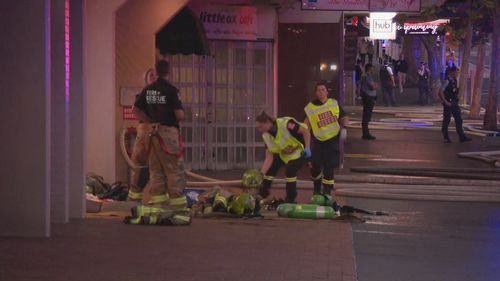 Flames and smoke can be seen coming from level 15 of the apartments on the ﻿corner of Liverpool and Oxford St in Darlinghurst.