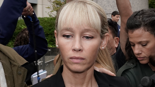 Sherri Papini leaves the federal courthouse after Federal Judge William Shubb sentenced her to 18 months in federal prison, in Sacramento, Calif., Monday, Sept. 19, 2022. Federal prosecutors had asked that she be sentenced to eight months in prison for faking her own kidnapping in 2016. (AP Photo/Rich Pedroncelli)