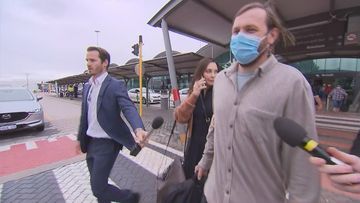 Tobias Moran arrives back at Perth Airport after being released on bail.