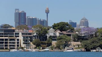 Sydney office buildings and commercial real estate appear behind Sydney waterfront properties