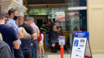 Queue at Roma Street Station in Brisbane for pop-up COVID-19 vaccination clinic.