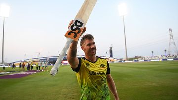 David Warner of Australia celebrates following the ICC Men&#x27;s T20 World Cup match between Australia and Windies at Sheikh Zayed stadium on November 06, 2021 in Abu Dhabi, United Arab Emirates. (Photo by Gareth Copley-ICC/ICC via Getty Images)