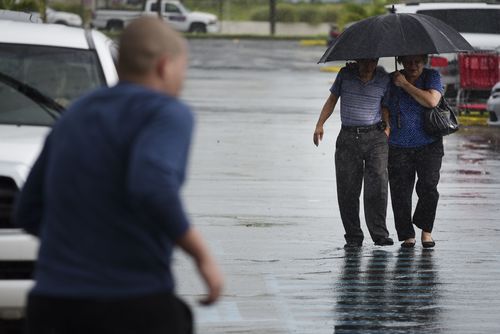 A couple arrive at a store to purchase supplies in preparation for Hurricane Irma, in Carolina, Puerto Rico. (AP)