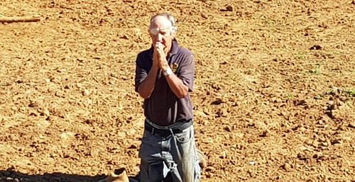 Alf King, praying for rain on his NSW farm.