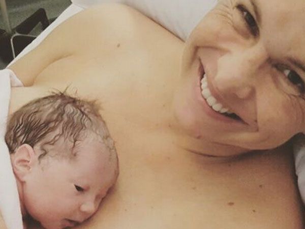 Libby Trickett with her new daughter, Poppy. (Supplied)
