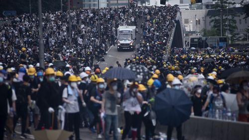 An ambulance aids injured protesters after confrontation with the riot police during the demonstration. 