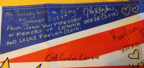 In 2020 Canadian truckie John Van Vyfeyken has driven the flag around British Columbia, asking people to sign it for the Fowler family in Sydney. 