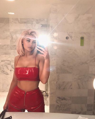 Kylie sports a racy red latex crop and high-waisted pants to her best friend Jordyn Wood's 21st birthday.