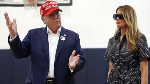 Republican presidential candidate former President Donald Trump speaks as former first lady Melania Trump listens after voting on Election Day at the Morton and Barbara Mandel Recreation Center, Tuesday, Nov. 5, 2024, in Palm Beach, Fla.