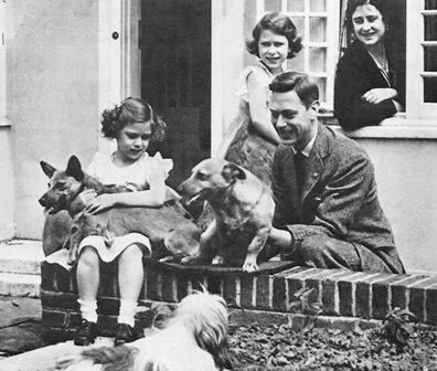 The Queen with her father the King and their dogs
