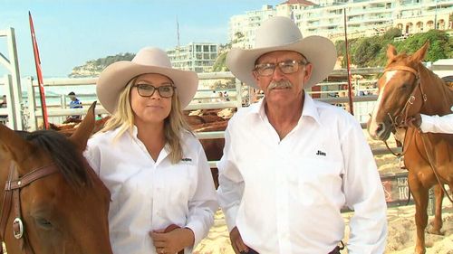 Megan McLoughlin (left) and her father Jim led a "Herd of Hope' along Bondi Beach today. (9NEWS)