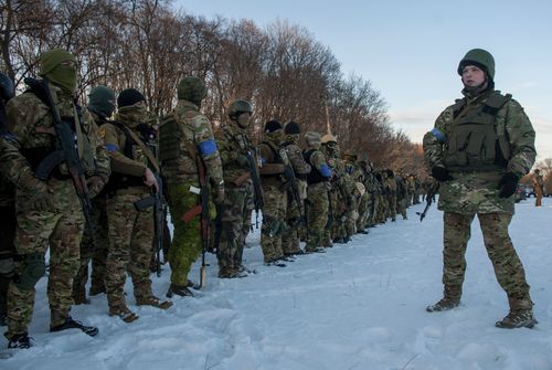 Ukrainian servicemen attend a training session outside Kharkiv, Ukraine, Friday, March 11, 2022.