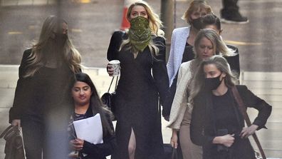 Actress Amber Heard, centre, arrives at the High Court in London for a hearing in Johnny Depp's libel case, Friday July 10, 2020