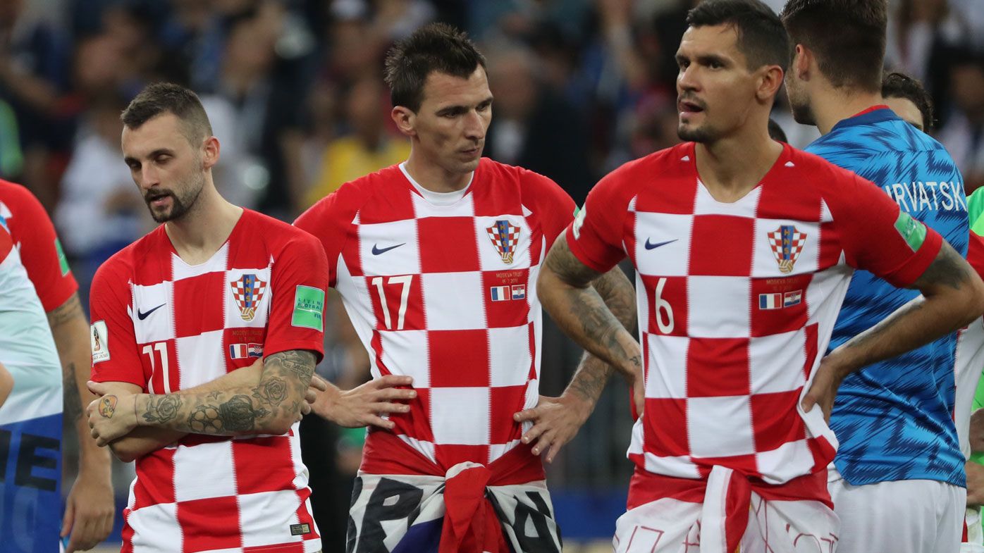 Mario Mandzukic (centre) comes to terms with Croatia's loss.