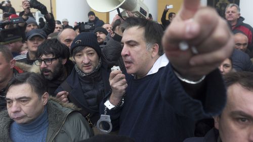 Mikheil Saakashvili addresses the crowd after he was released. (AAP)