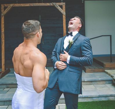 Bride pranks groom with best man wearing a wedding dress