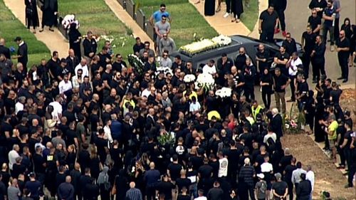 A sea of people draped in black attended the bural service. (Supplied)