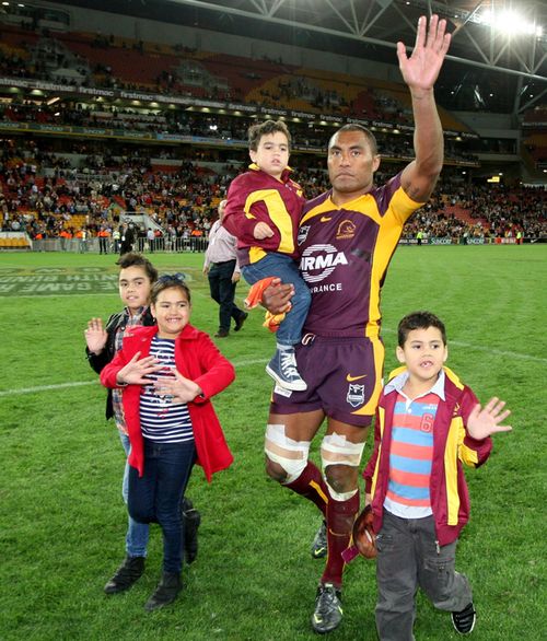 Petero Civoniceva with his family waves to the crowd after the Brisbane Broncos v Penrith Panthers at Brisbane in 2012. (AAP)