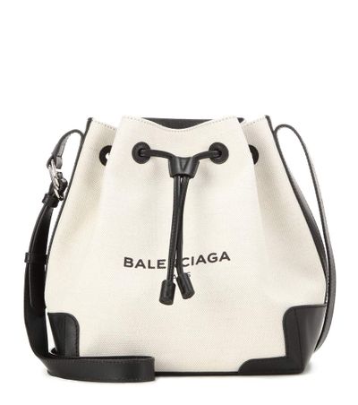 <a href="http://www.mytheresa.com/en-au/canvas-and-leather-bucket-bag-552186.html" target="_blank">Bag, $1515, Balenciaga at MyTheresa.com</a>