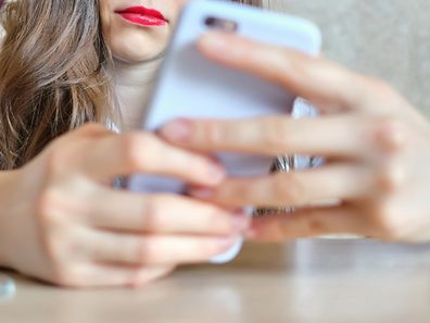 Woman texting on phone