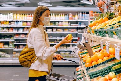 Woman in face mask at grocery store