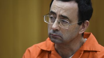 Larry Nassar listens as Rachael Denhollander gives her victim impact statement Friday, February 2, 2018. 