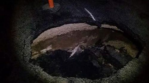 Sinkhole opens under Queensland highway