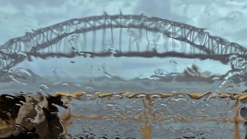 The Sydney Harbour Bridge seen through the windscreen of a car as rain pours on the city, Monday, Feb. 28, 2022. The state of New South Wales has seen more than 500 flood rescues and 927 requests for assistance in the past 24 hours as record rain continues to fall across the eastern states of Australia. (AP Photo/Mark Baker)