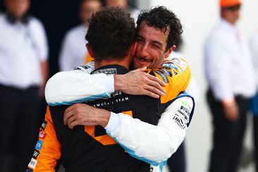 Race winner Lando Norris of Great Britain and McLaren celebrates with Daniel Ricciardo of Australia and Visa Cash App RB in parc ferme after the F1 Grand Prix of Miami at Miami International Autodrome on May 05, 2024 in Miami, Florida. (Photo by Mark Thompson/Getty Images)