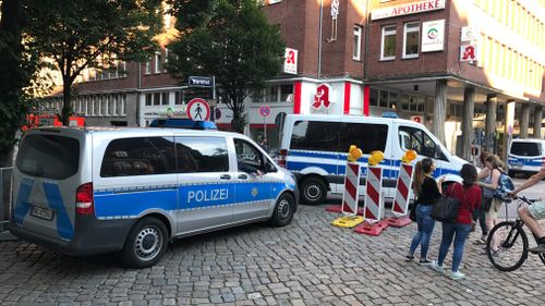 Pedestrians are stopped by police. (Seb Costello)