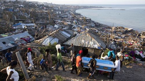 Residents carry a coffin containing the remains of a pregnant woman, a victim of Hurricane Matthew, in Jeremie, Haiti. (AP)